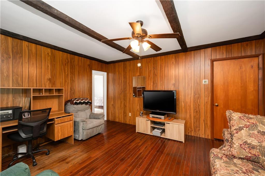 411 Harmony Road Baden, PA 15005 - Photo 7 of 25 a living room with furniture and a flat screen tv