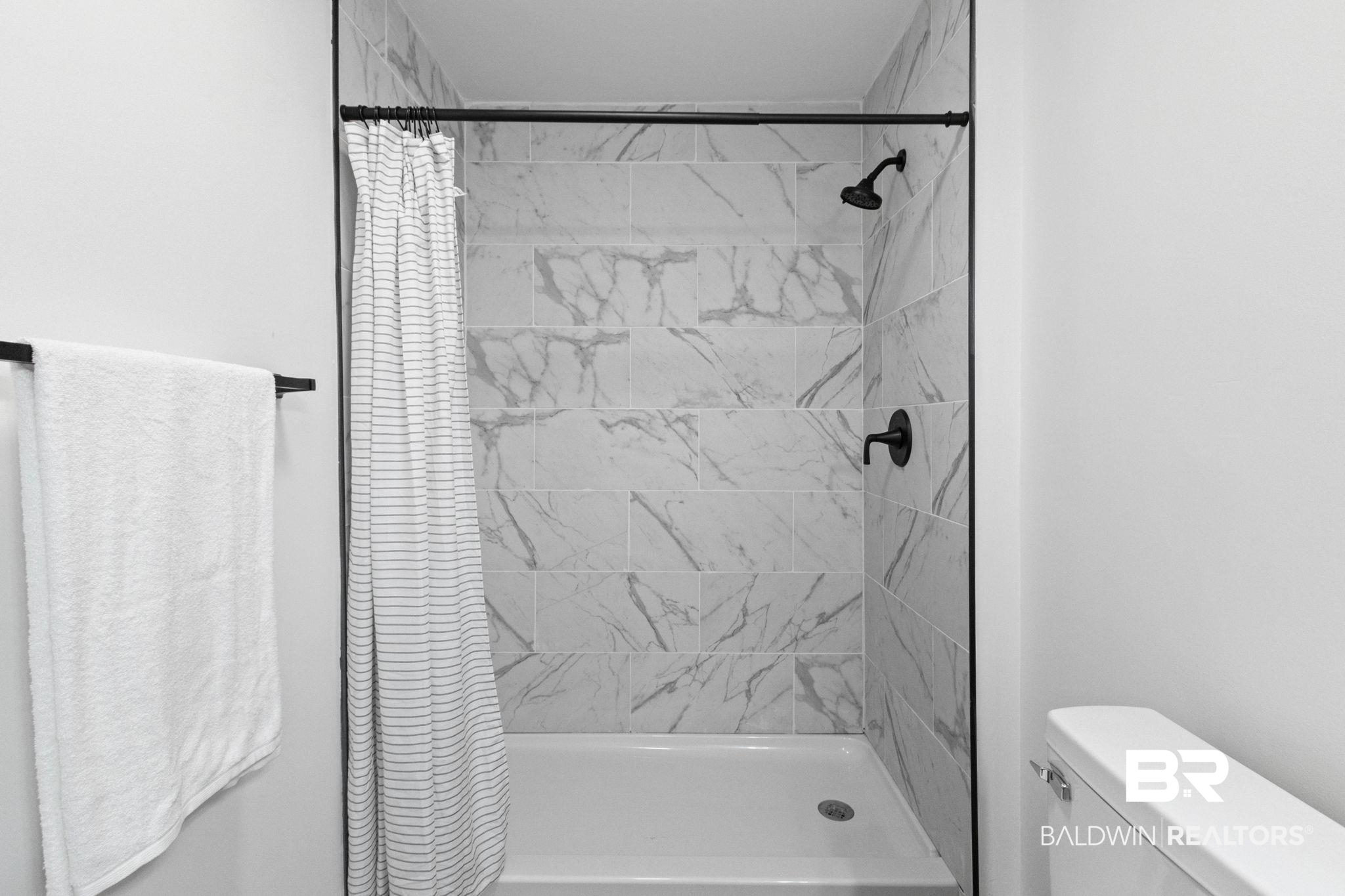 128 Bush Avenue Mobile, AL 36604 - Photo 24 of 40 Full bathroom featuring toilet and a shower stall