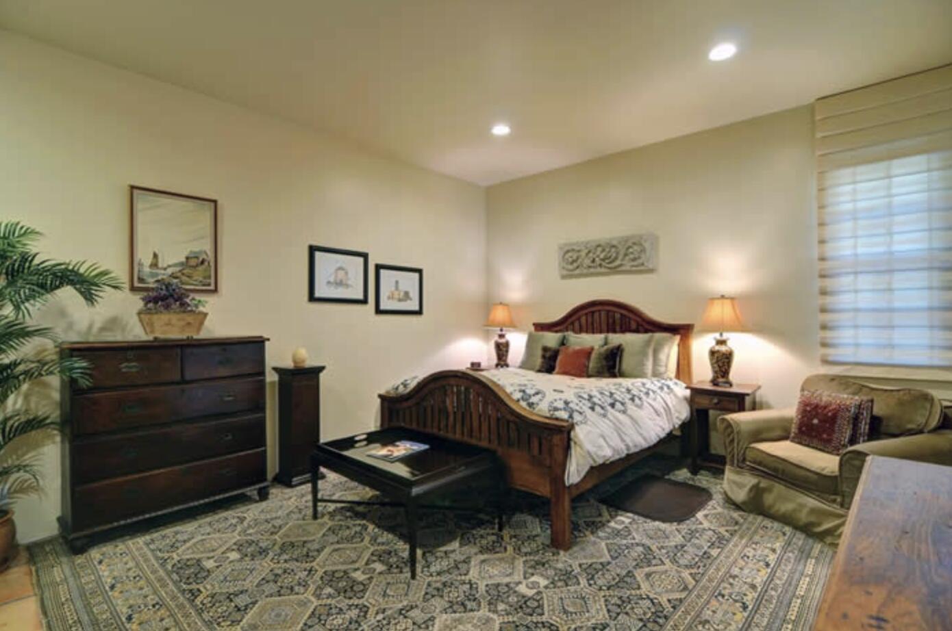 3756 Foothill Road Santa Barbara, CA 93105 - Photo 23 of 70 a bedroom with a bed and wooden floor