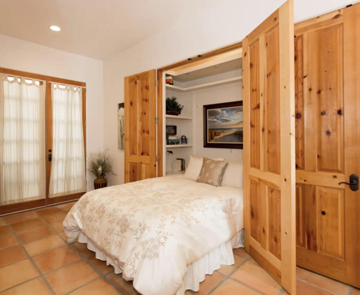 3756 Foothill Road Santa Barbara, CA 93105 - Photo 25 of 70 a bedroom with a large bed and a large mirror