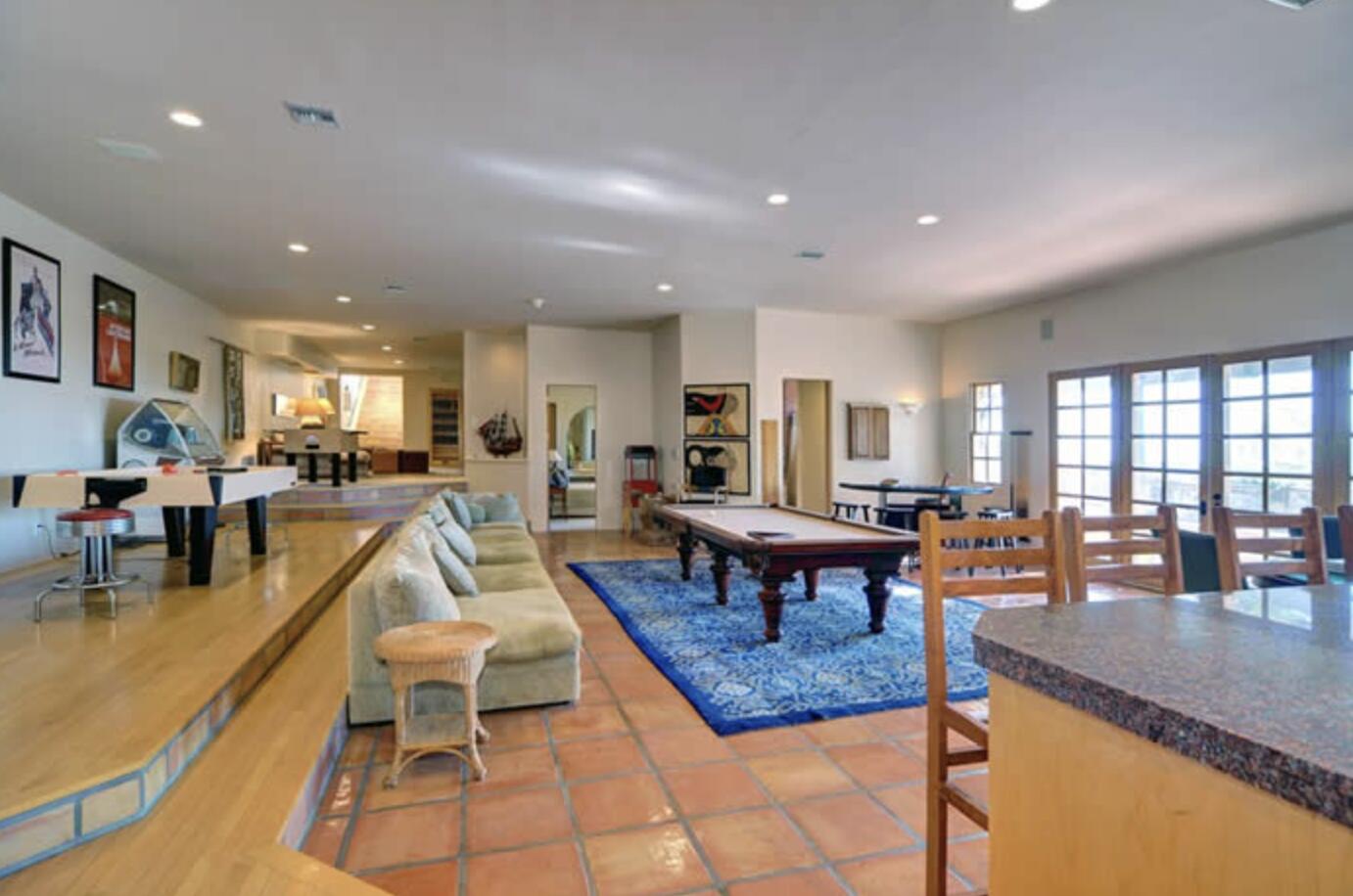 3756 Foothill Road Santa Barbara, CA 93105 - Photo 28 of 70 a living room with furniture a dining table and a potted plant