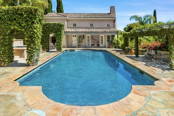 a view of a swimming pool with a patio