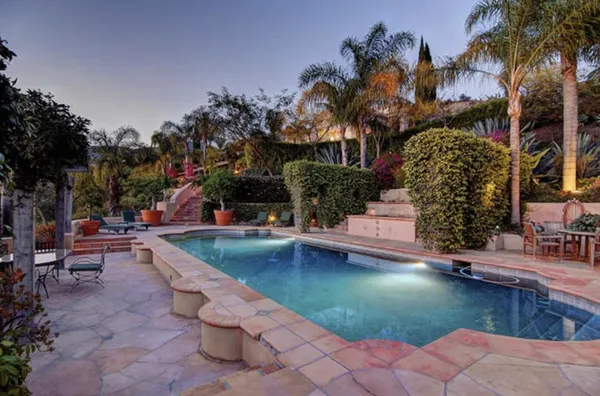 a backyard of a house with lots of green space