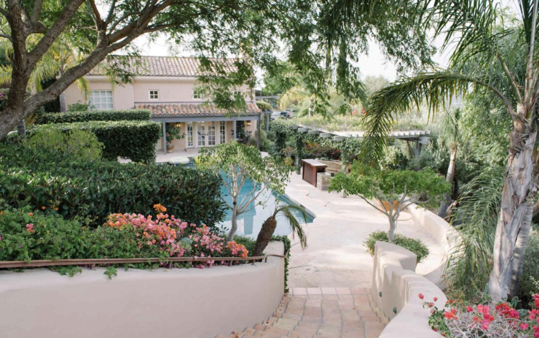 3756 Foothill Road Santa Barbara, CA 93105 - Photo 46 of 70 a front view of a house with a yard and fountain in middle