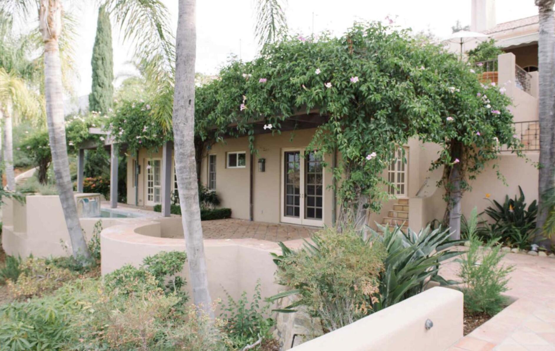 3756 Foothill Road Santa Barbara, CA 93105 - Photo 47 of 70 a view of a house with a small yard and potted plants