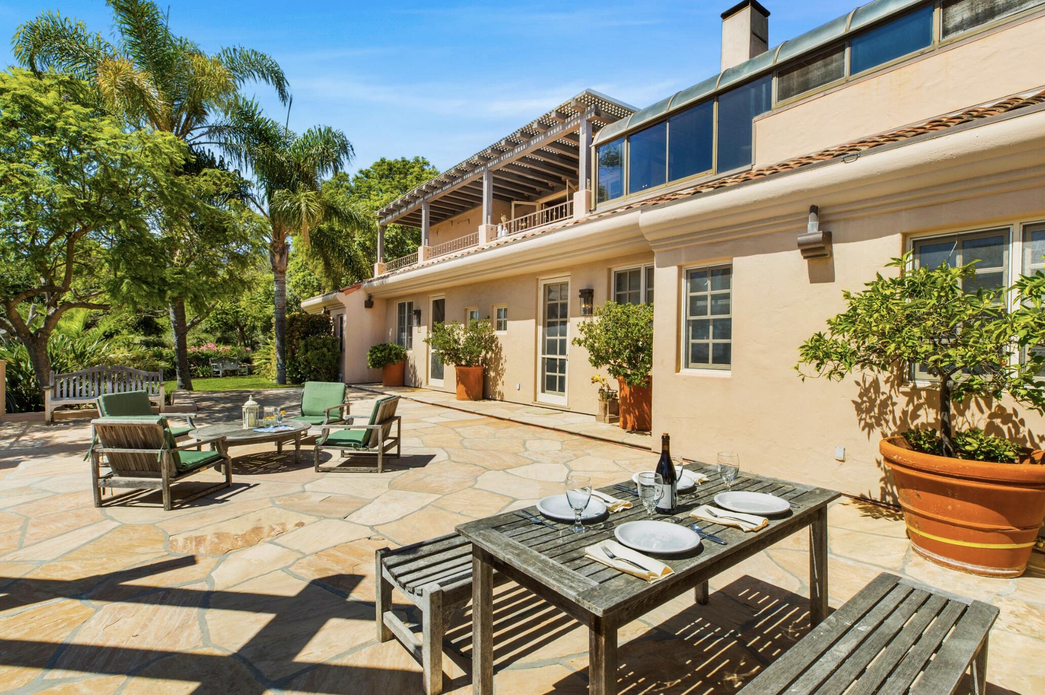 3756 Foothill Road Santa Barbara, CA 93105 - Photo 60 of 70 a view of a patio with couches table and chairs and potted plants