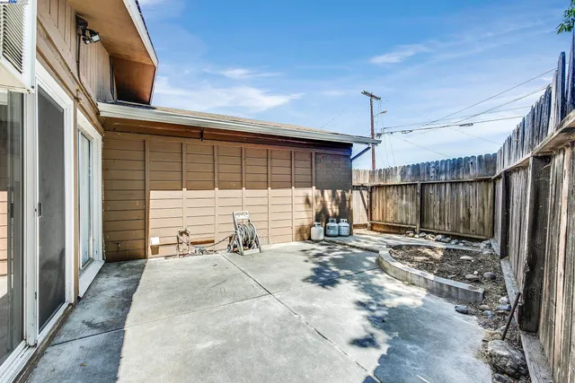 a view of a backyard with a patio
