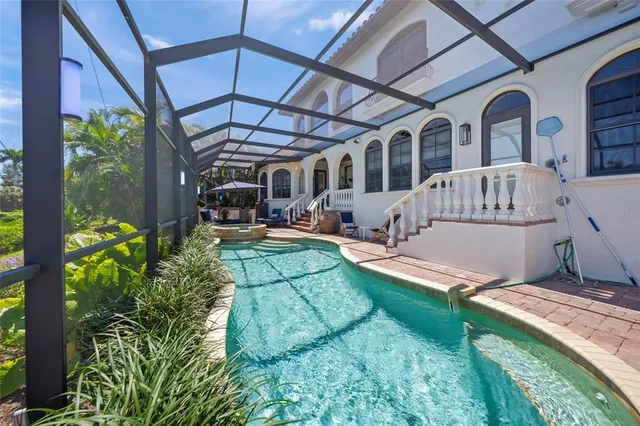 a view of a lake with chairs