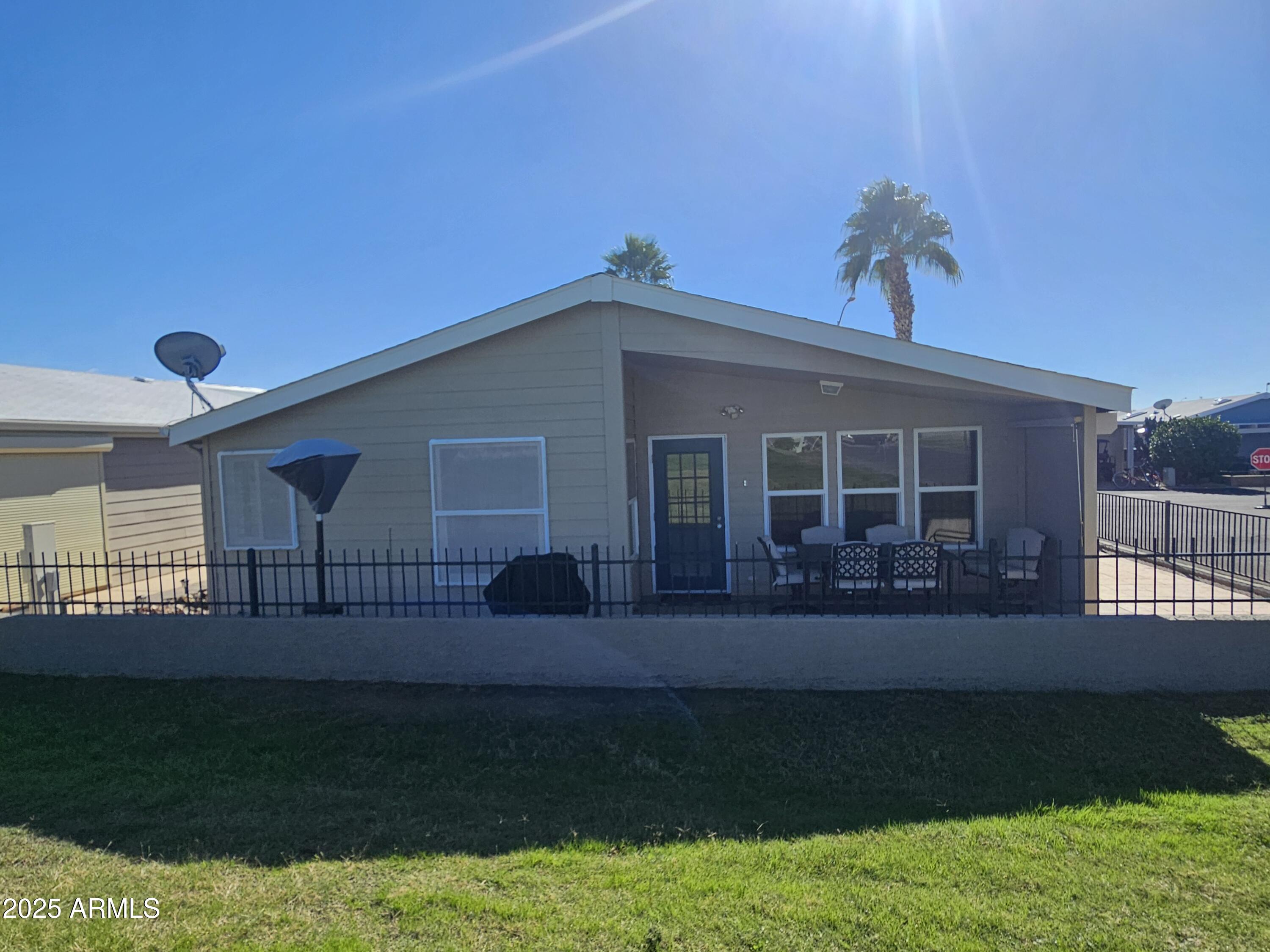 650 North Hawes Road, Unit 4820 Mesa, AZ 85207 - Photo 2 of 54 a front view of a house with garden