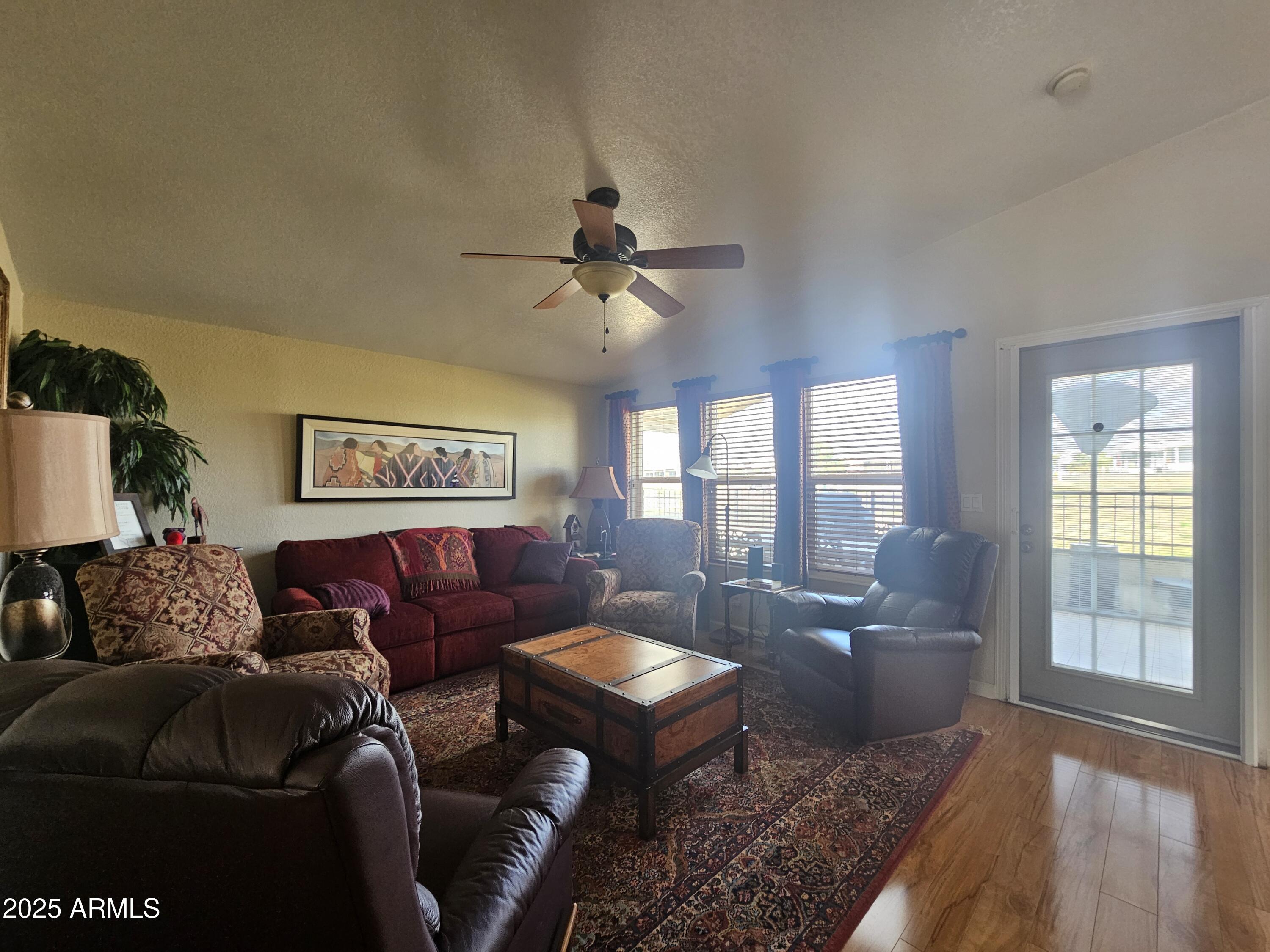 650 North Hawes Road, Unit 4820 Mesa, AZ 85207 - Photo 28 of 54 a living room with furniture and a large window