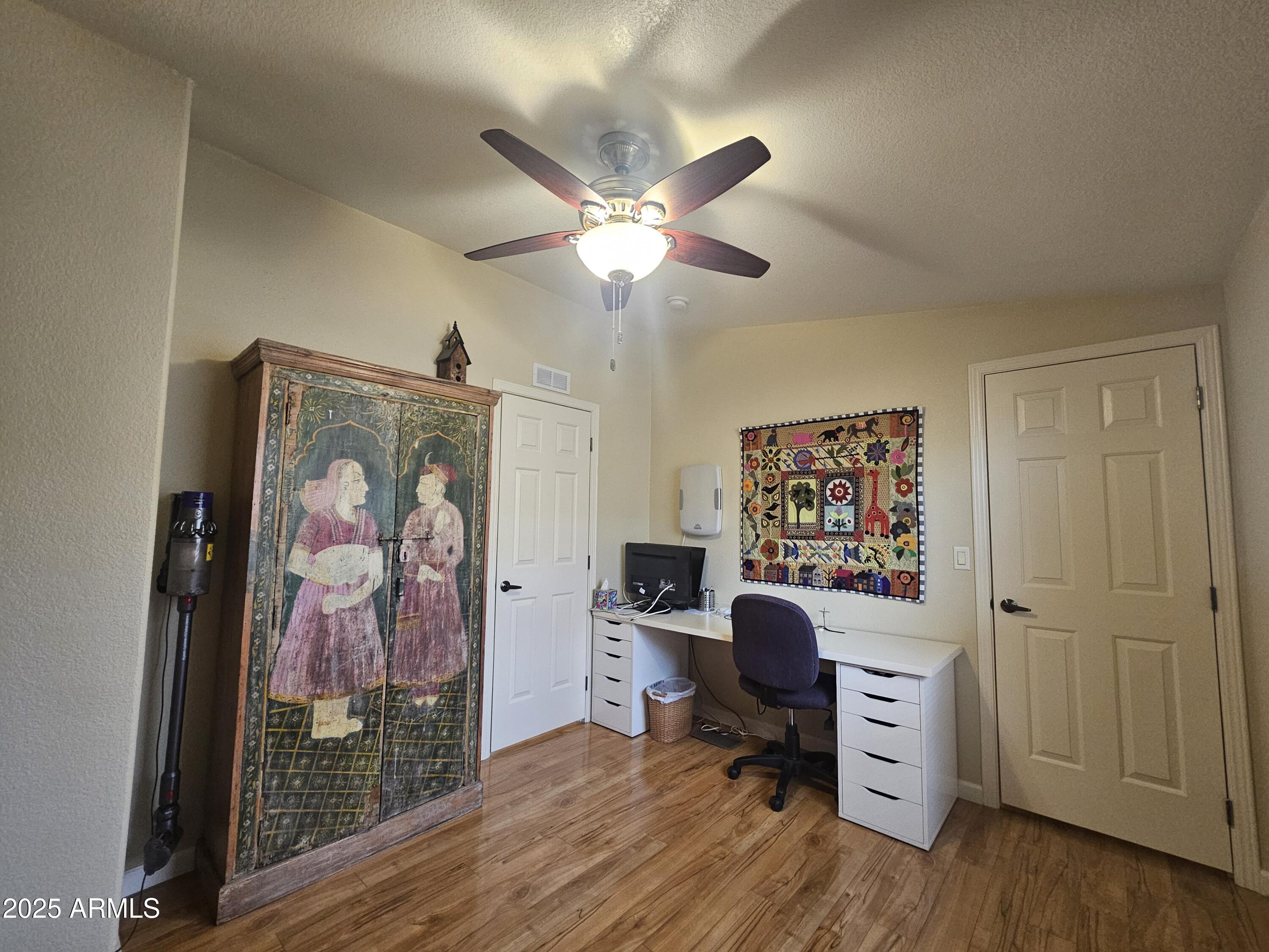 650 North Hawes Road, Unit 4820 Mesa, AZ 85207 - Photo 33 of 54 a view of a workspace with furniture and a window