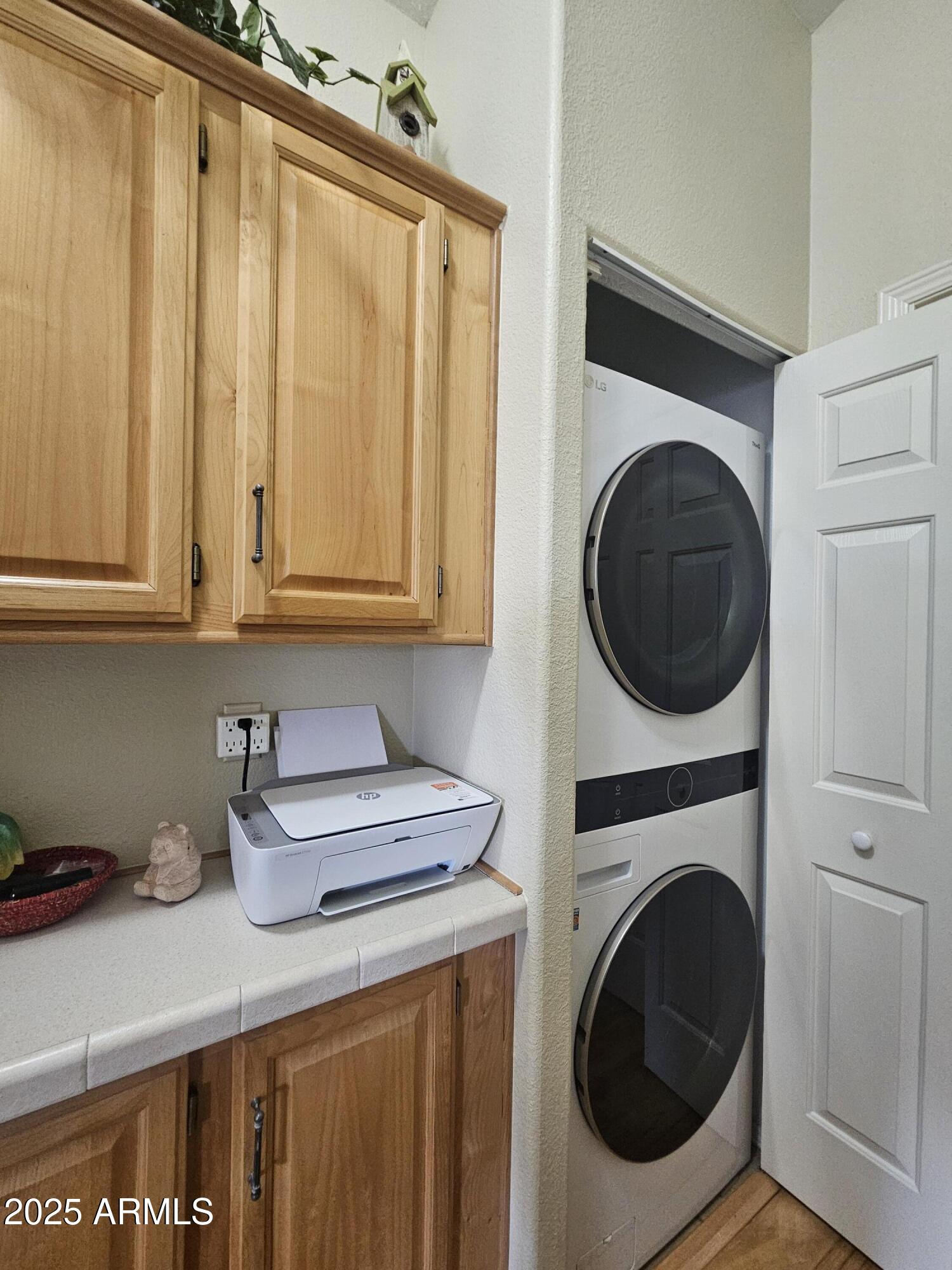 650 North Hawes Road, Unit 4820 Mesa, AZ 85207 - Photo 36 of 54 a utility room with sink dryer and washer