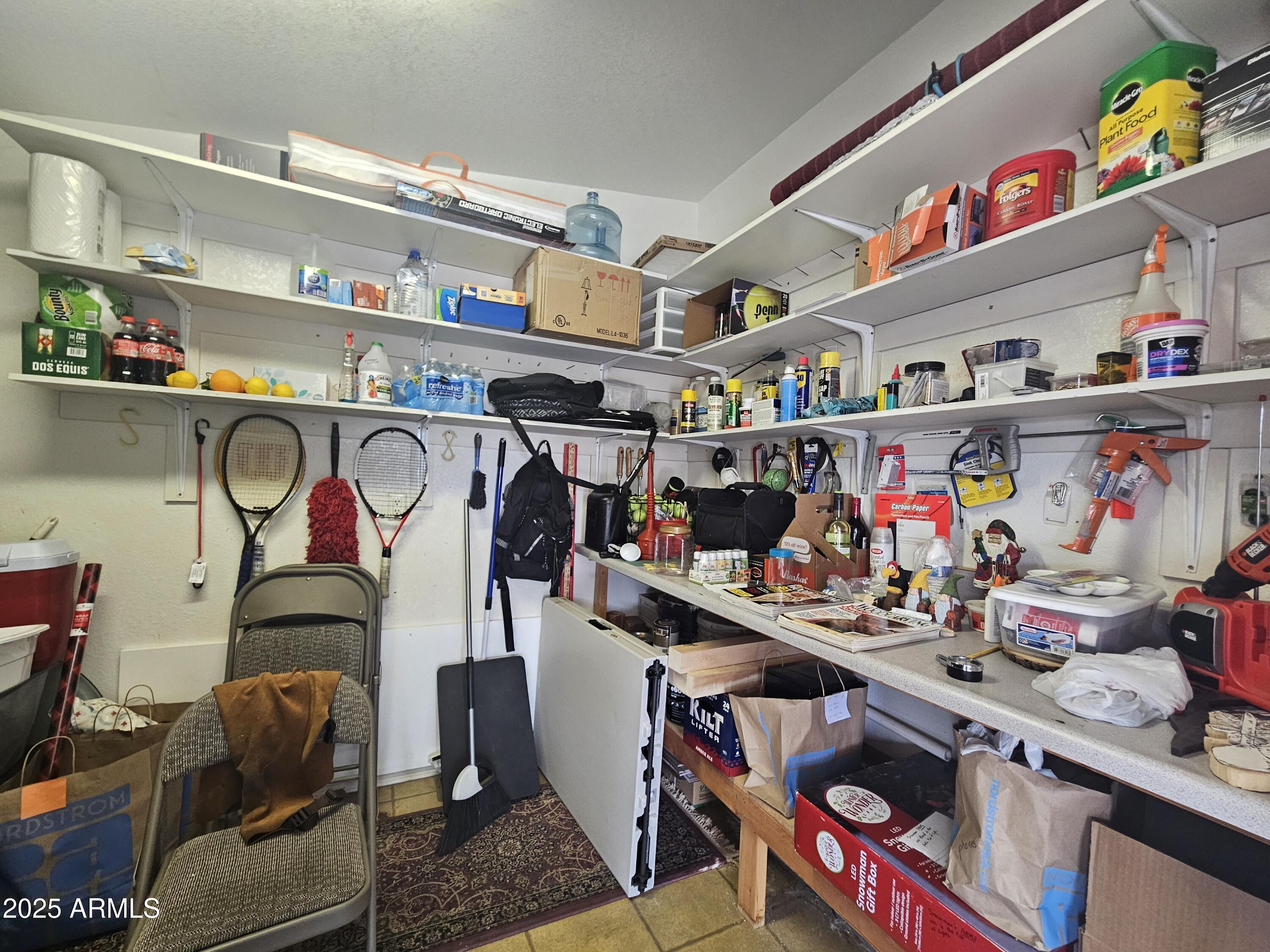 650 North Hawes Road, Unit 4820 Mesa, AZ 85207 - Photo 45 of 54 a store room with lots of different furniture and clutter