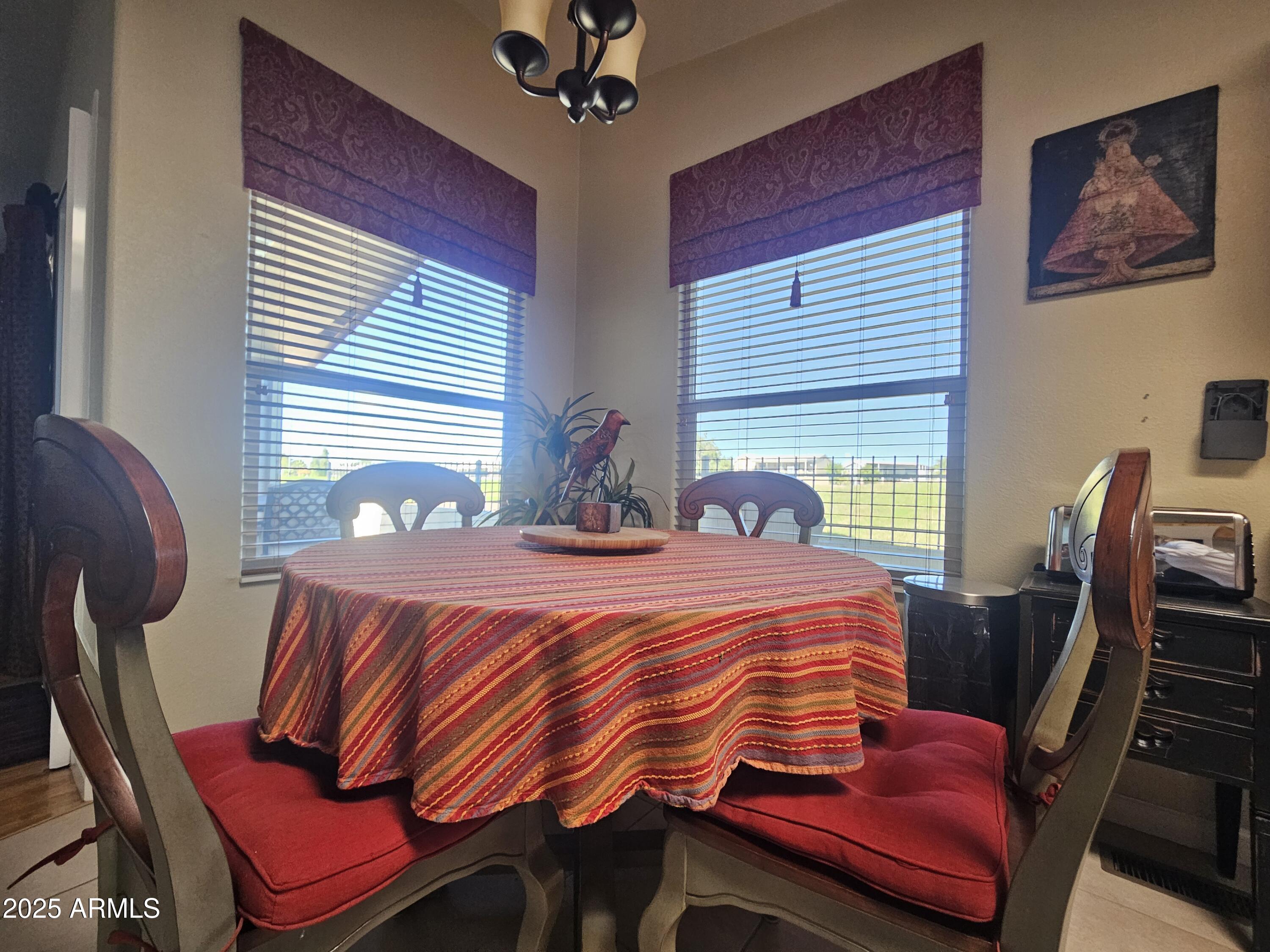 650 North Hawes Road, Unit 4820 Mesa, AZ 85207 - Photo 9 of 54 a bedroom with a bed and wooden floor