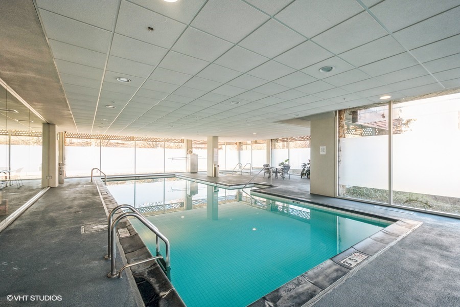 800 Elgin Road, Unit 517 Evanston, IL 60201 - Photo 17 of 20 a view of a swimming pool and lounge chair