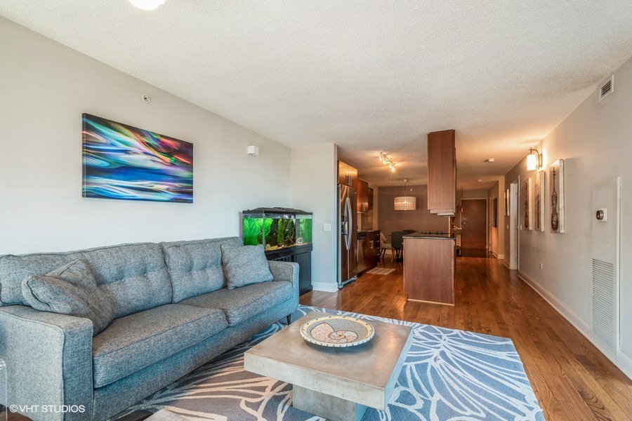800 Elgin Road, Unit 517 Evanston, IL 60201 - Photo 5 of 20 a living room with furniture and wooden floor