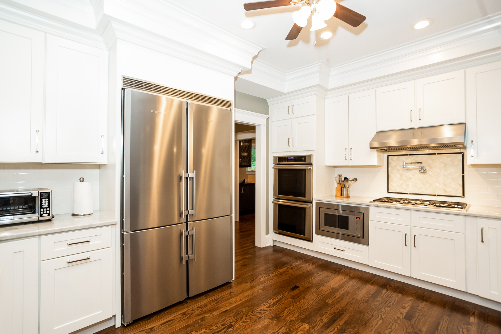 192 Riverside Road Riverside, IL 60546 - Photo 13 of 56 a kitchen with stainless steel appliances a refrigerator sink and cabinets