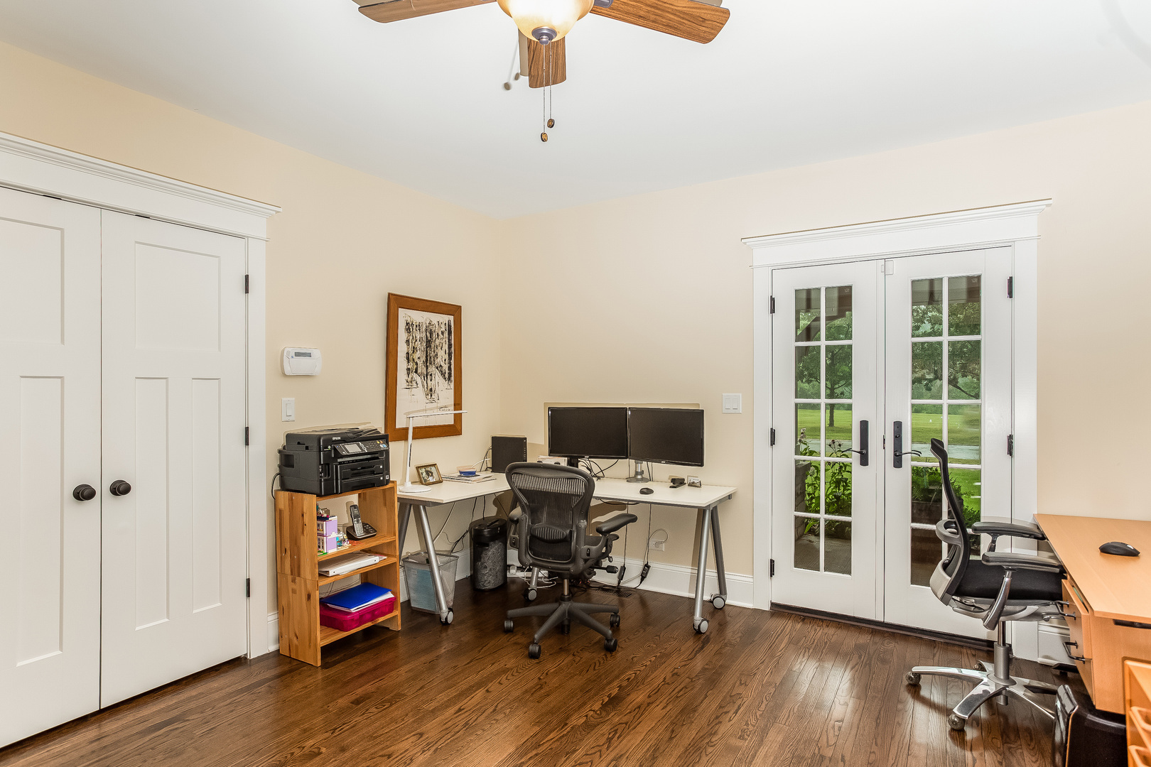 192 Riverside Road Riverside, IL 60546 - Photo 17 of 56 a view of a workspace with wooden floor and gym equipment