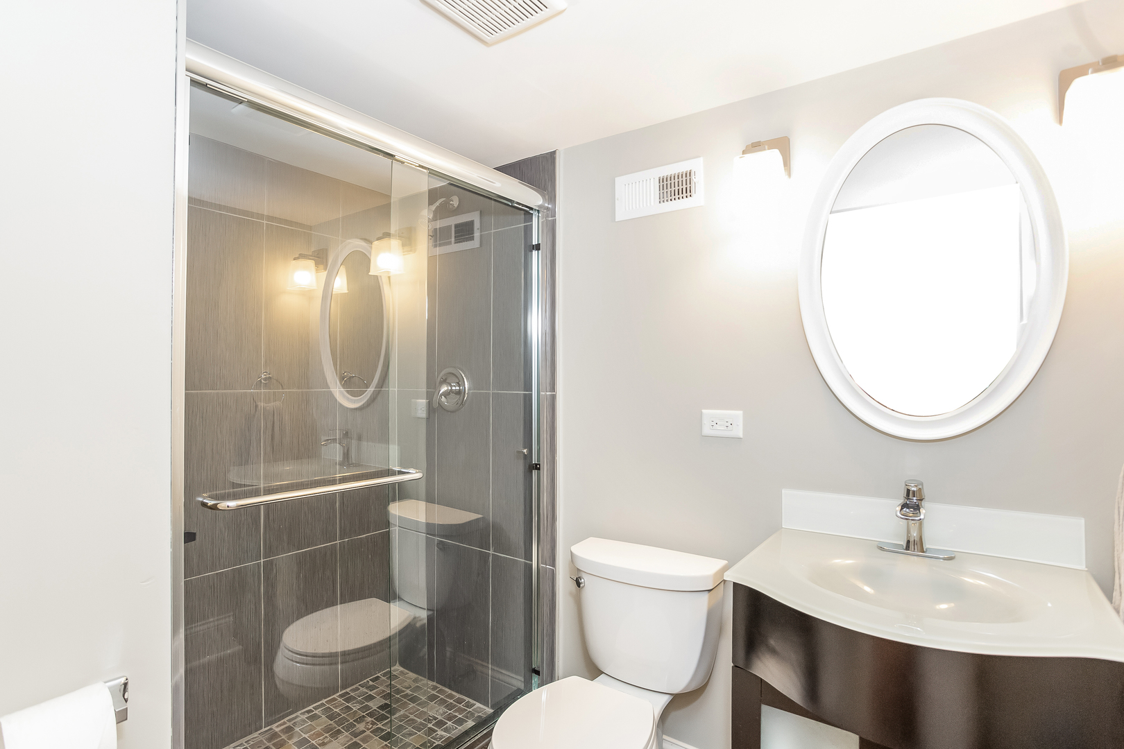 192 Riverside Road Riverside, IL 60546 - Photo 38 of 56 a bathroom with a sink toilet a mirror and shower
