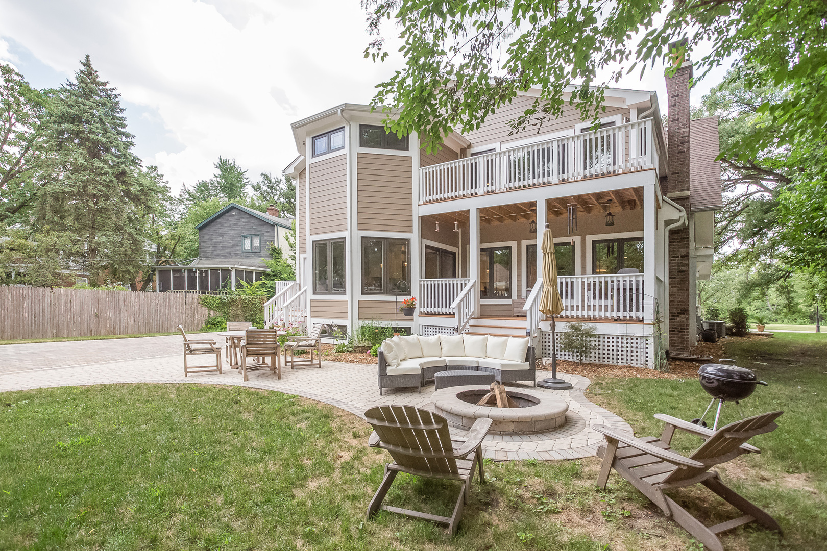 192 Riverside Road Riverside, IL 60546 - Photo 44 of 56 a view of a house with backyard sitting area and garden