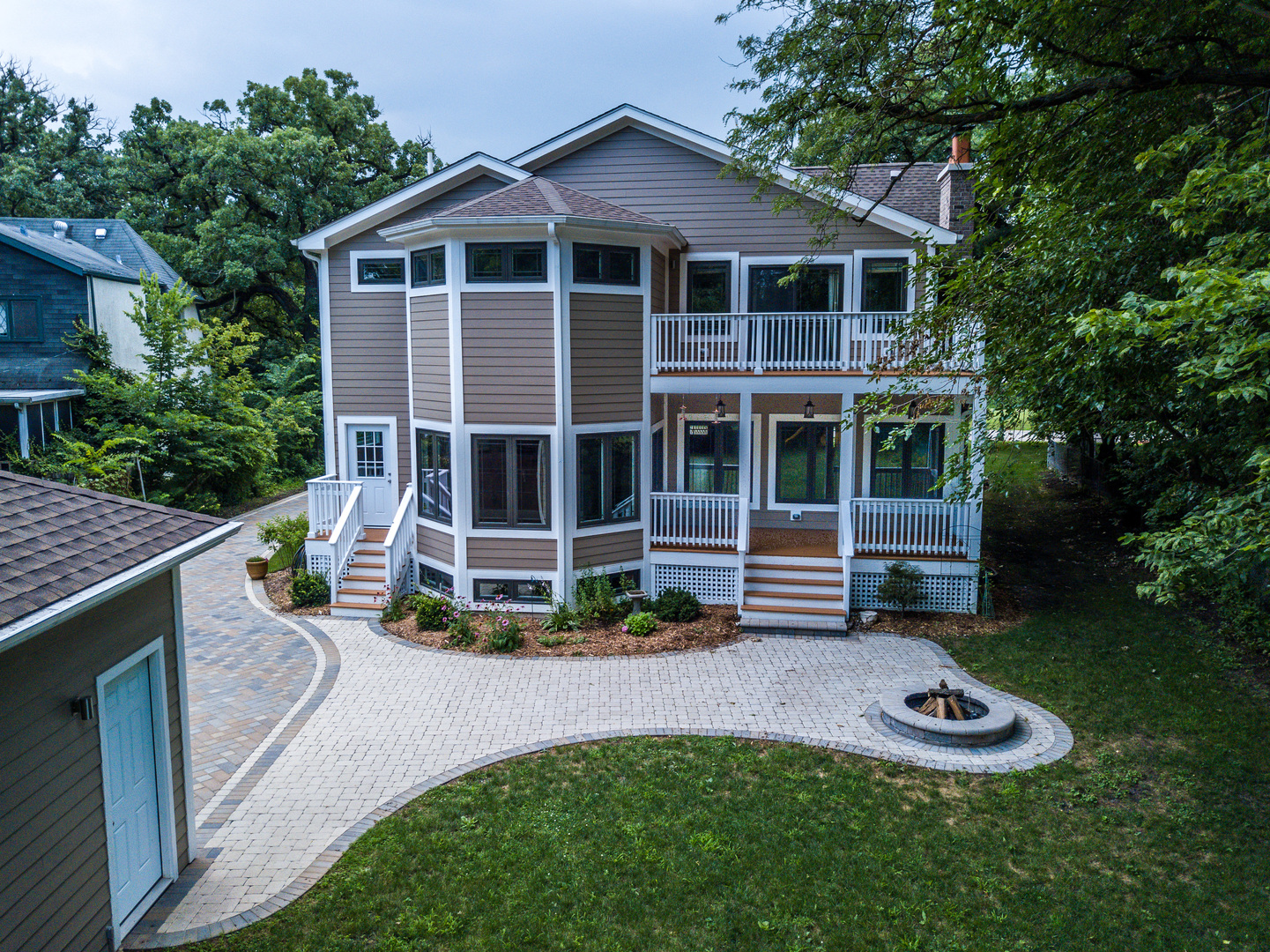 192 Riverside Road Riverside, IL 60546 - Photo 45 of 56 a view of a house with a yard porch and wooden fence