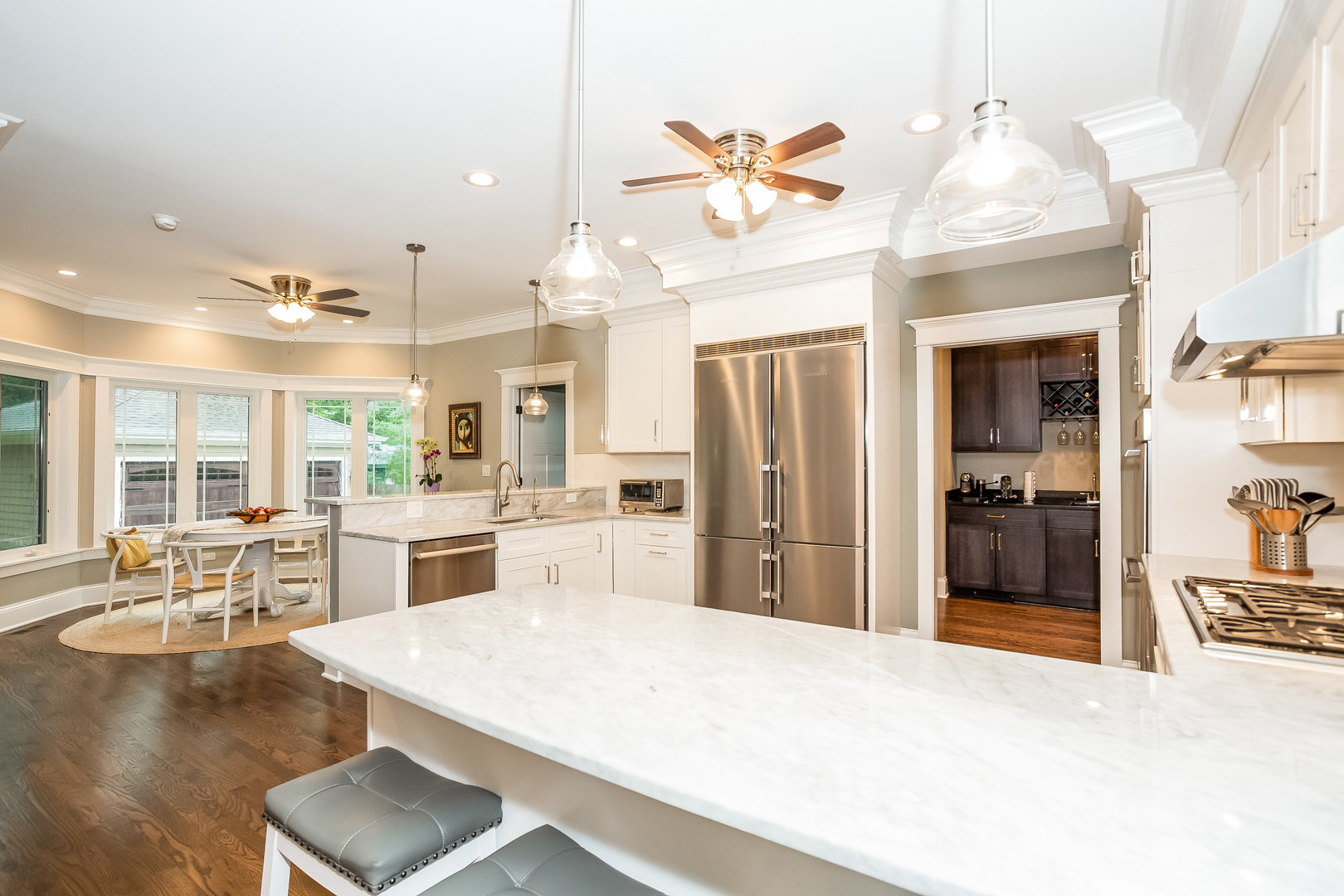 192 Riverside Road Riverside, IL 60546 - Photo 10 of 56 a room with stainless steel appliances kitchen island granite countertop a refrigerator a stove and white cabinets with wooden floor