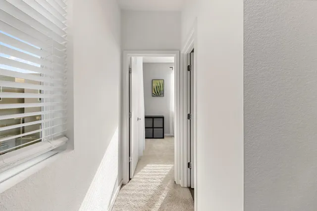 a view of a room that has a table and chair