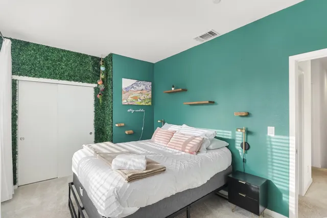 a en suite bathroom with double sink and a mirror