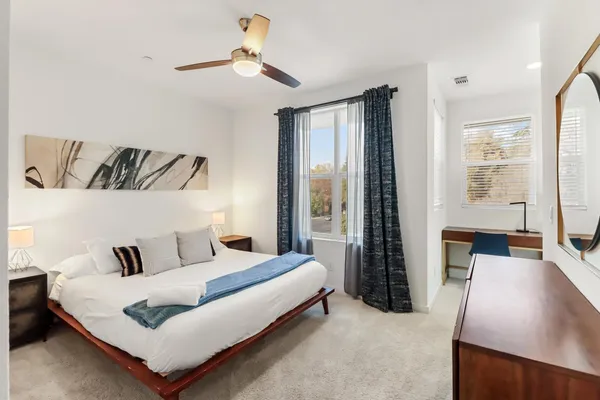 a bedroom with a bed and a walk in closet
