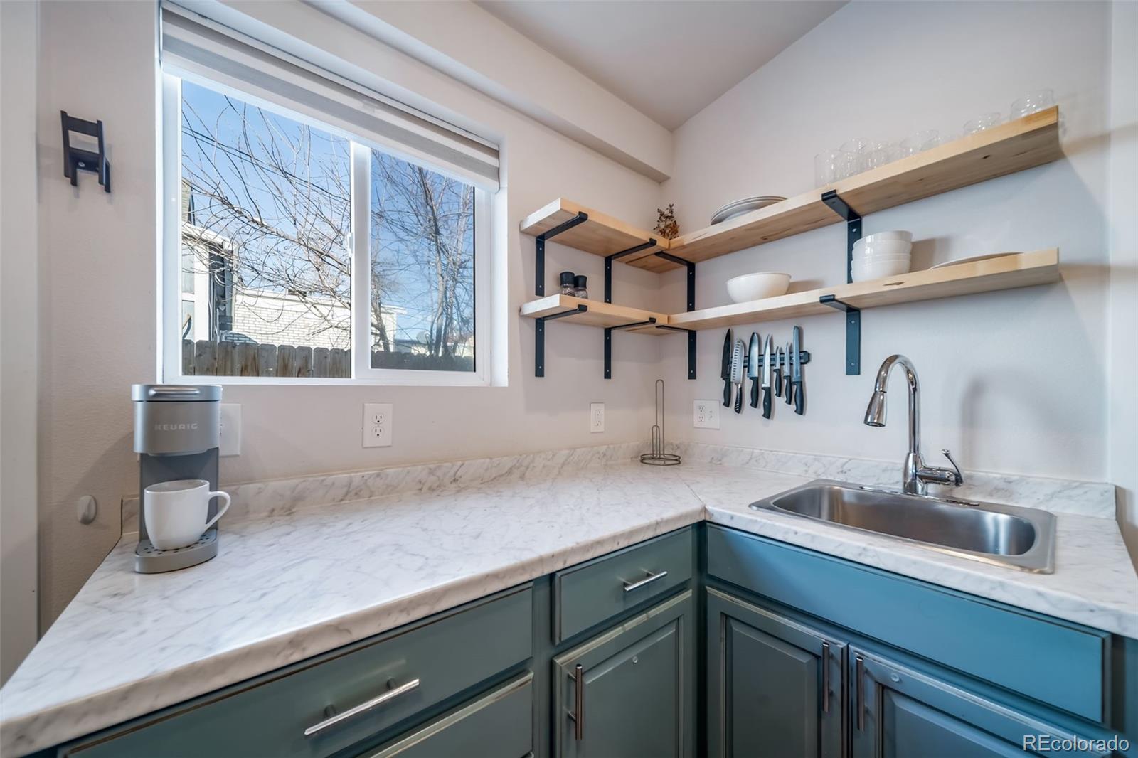 3536 North Williams Street, Unit 1 5 Denver, CO 80205 - Photo 7 of 15 a kitchen with a sink and a window