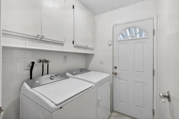 a utility room with dryer and washer