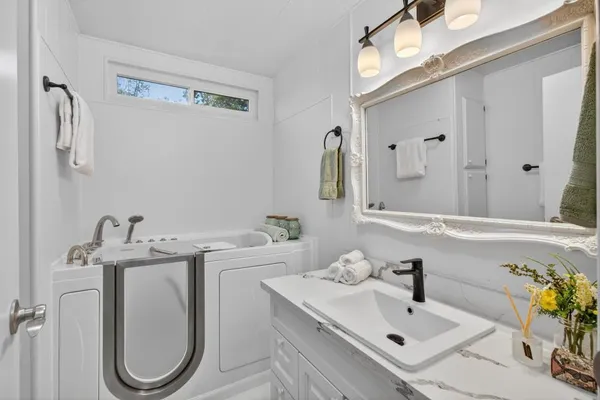 a bathroom with a sink and a mirror