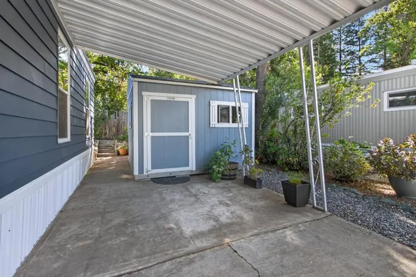 a view of a house with garden and plants