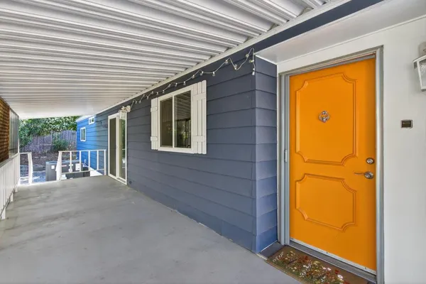 a view of porch with a door