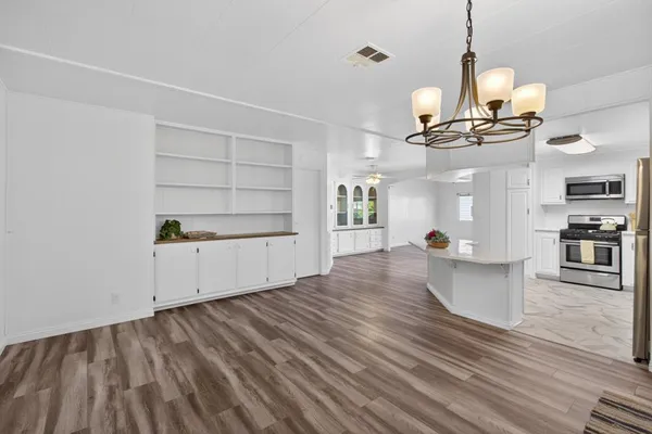 a view of a hallway with a wooden door