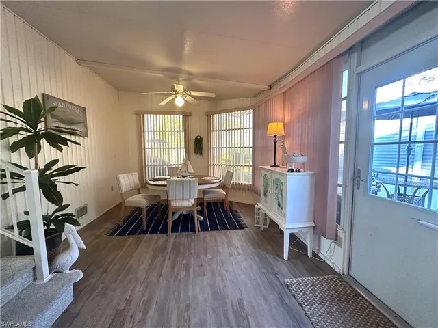 a view of a livingroom with furniture and a window