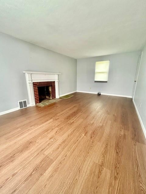 5384 Highgrove Road Pittsburgh, PA 15234 - Photo 2 of 13 Living Room has luxury vinyl flooring, a decorative fireplace and closet.