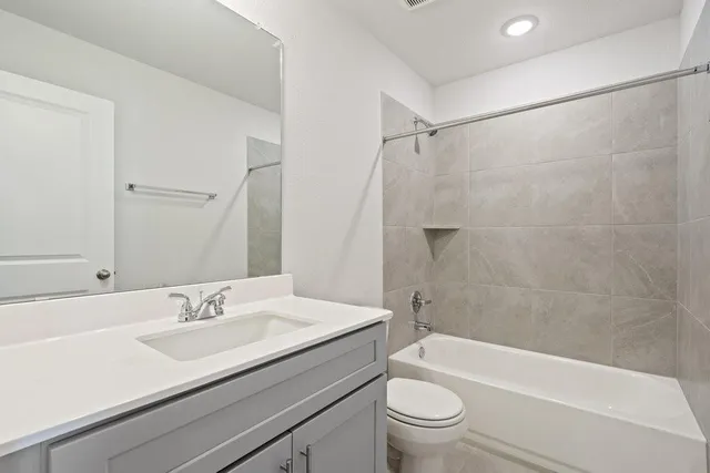 a bathroom with a sink a toilet and a bathtub