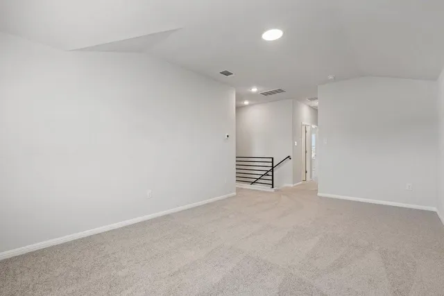 a view of room with stairs and a chandelier fan