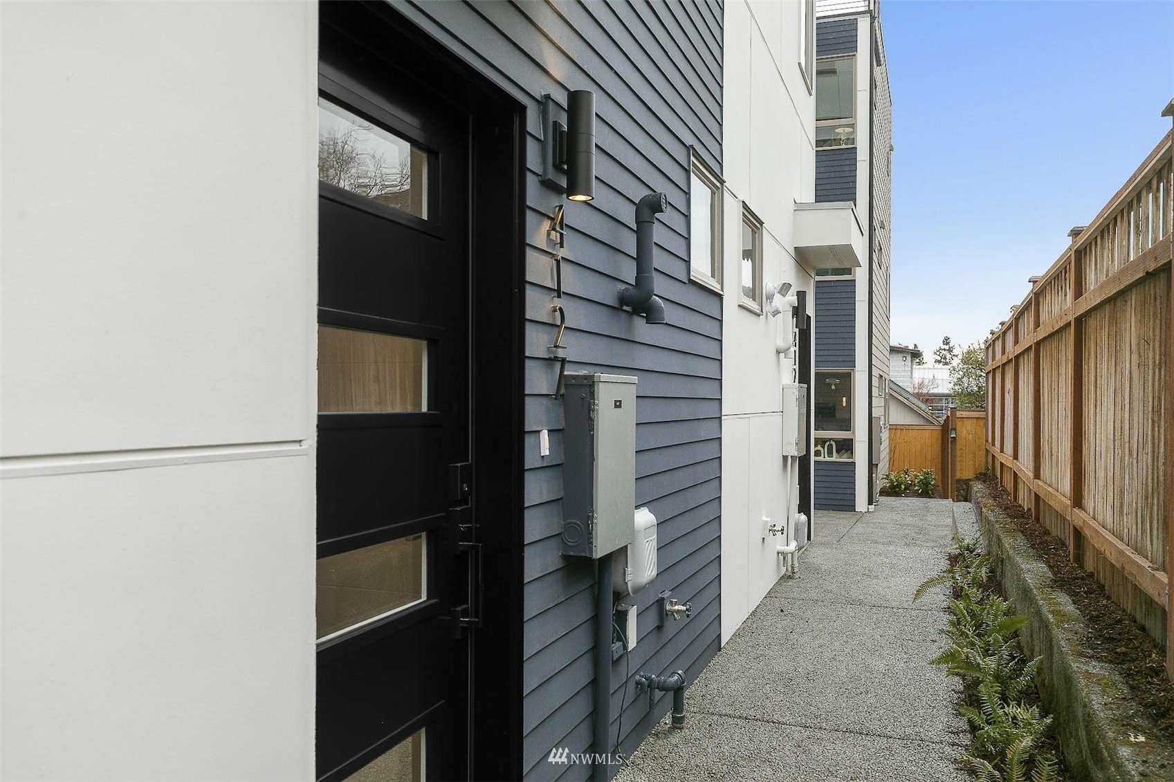 4125 Wallingford Avenue North Seattle, WA 98103 - Photo 2 of 28 a view of a pathway along the building