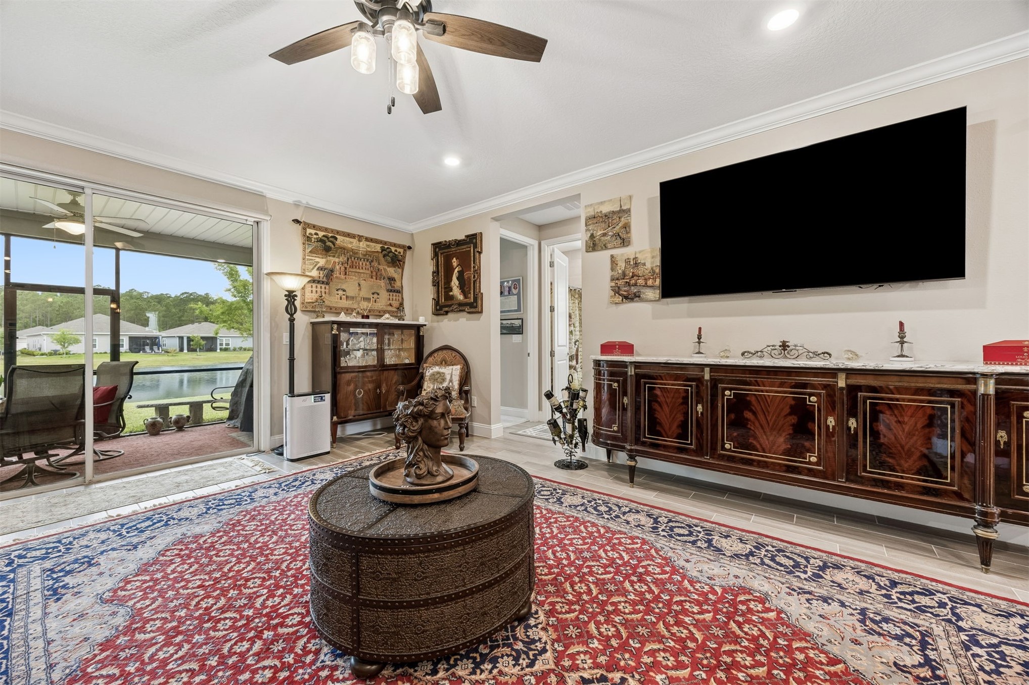 75133 Pondside Lane Yulee, FL 32097 - Photo 12 of 65 a living room with furniture and a flat screen tv