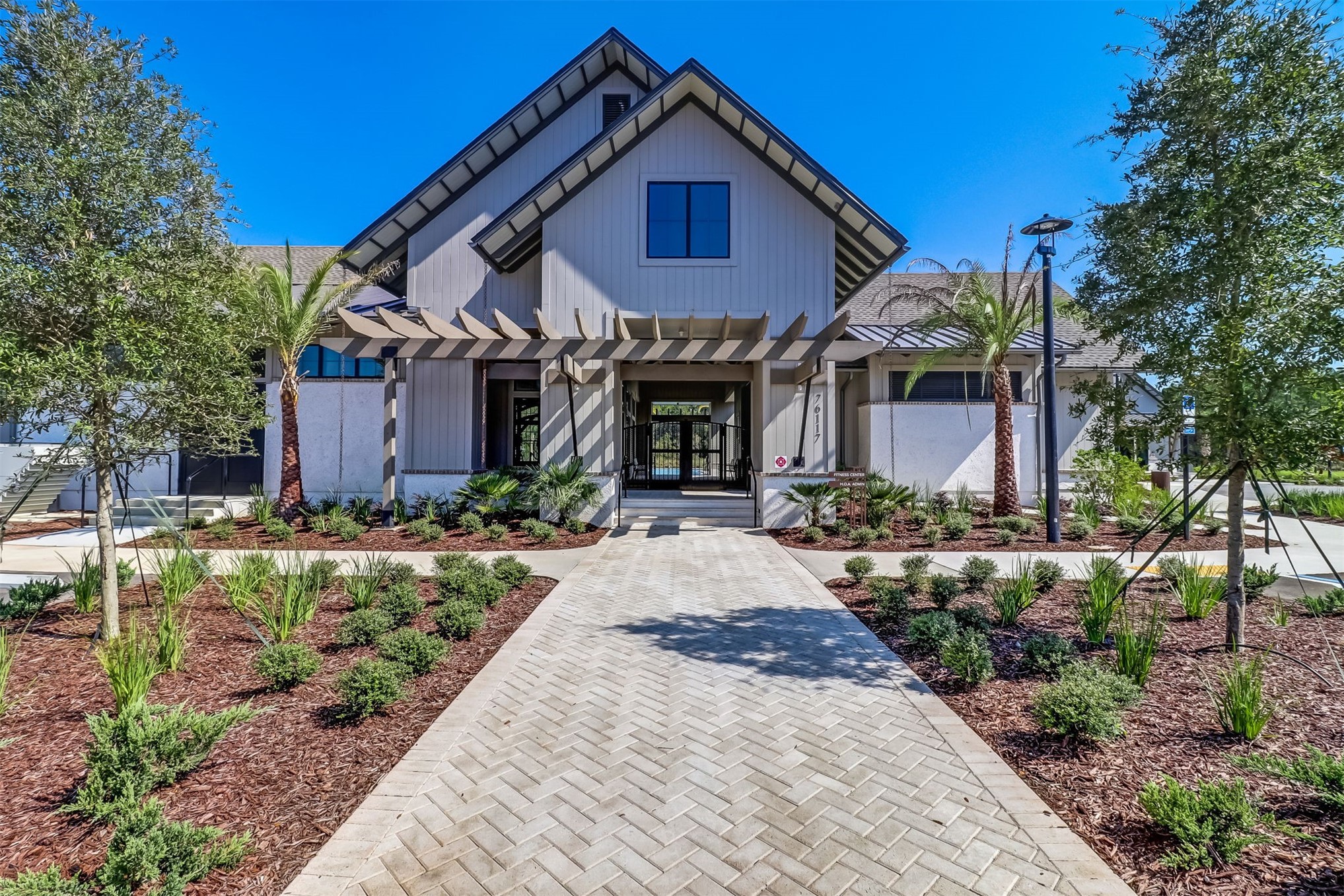 75133 Pondside Lane Yulee, FL 32097 - Photo 48 of 65 a front view of a house with garden