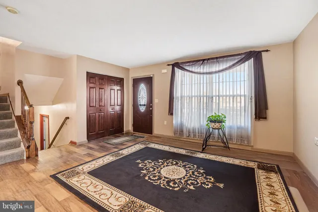 a view of an empty room and a window