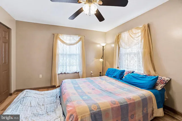 a bedroom with a bed and window