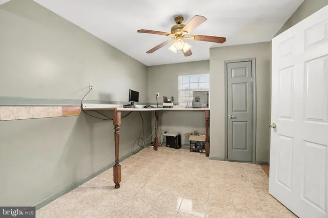 a view of a workspace with furniture