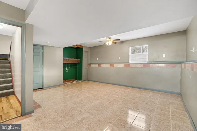 a view of a big room with windows and cabinet