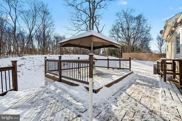 a view of a backyard with a bench