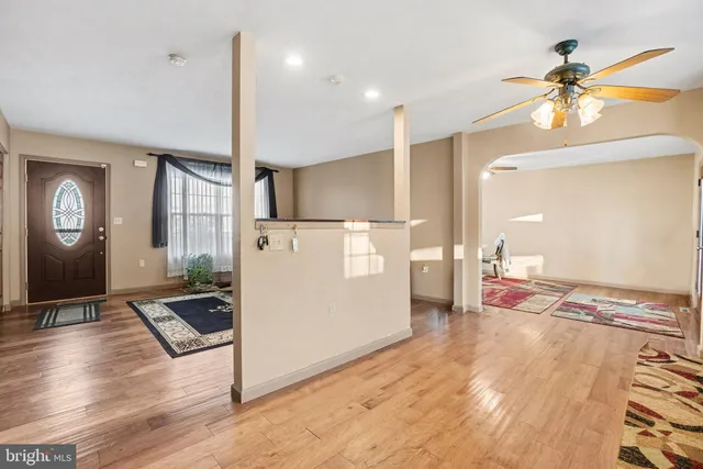 a view of kitchen with sink and refrigerator