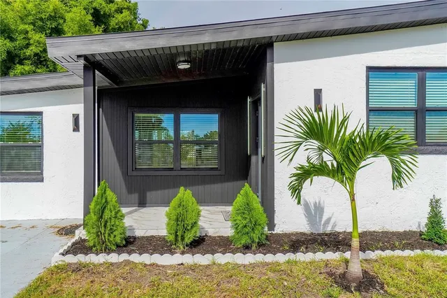 a front view of house with yard and seating space