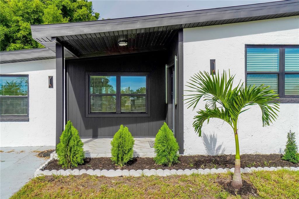a front view of house with yard and seating space